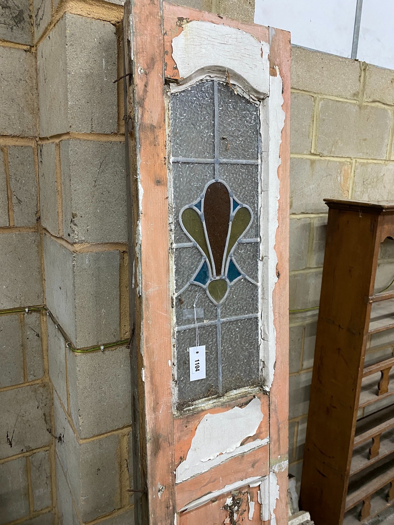 A pair of painted and stained glass inset doors, width 35cm height 209cm and a set of eight painted leaded glass windows, 46 x 51cm